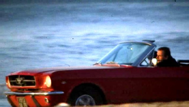 Red Mustang convertible is Trintignant company car...
